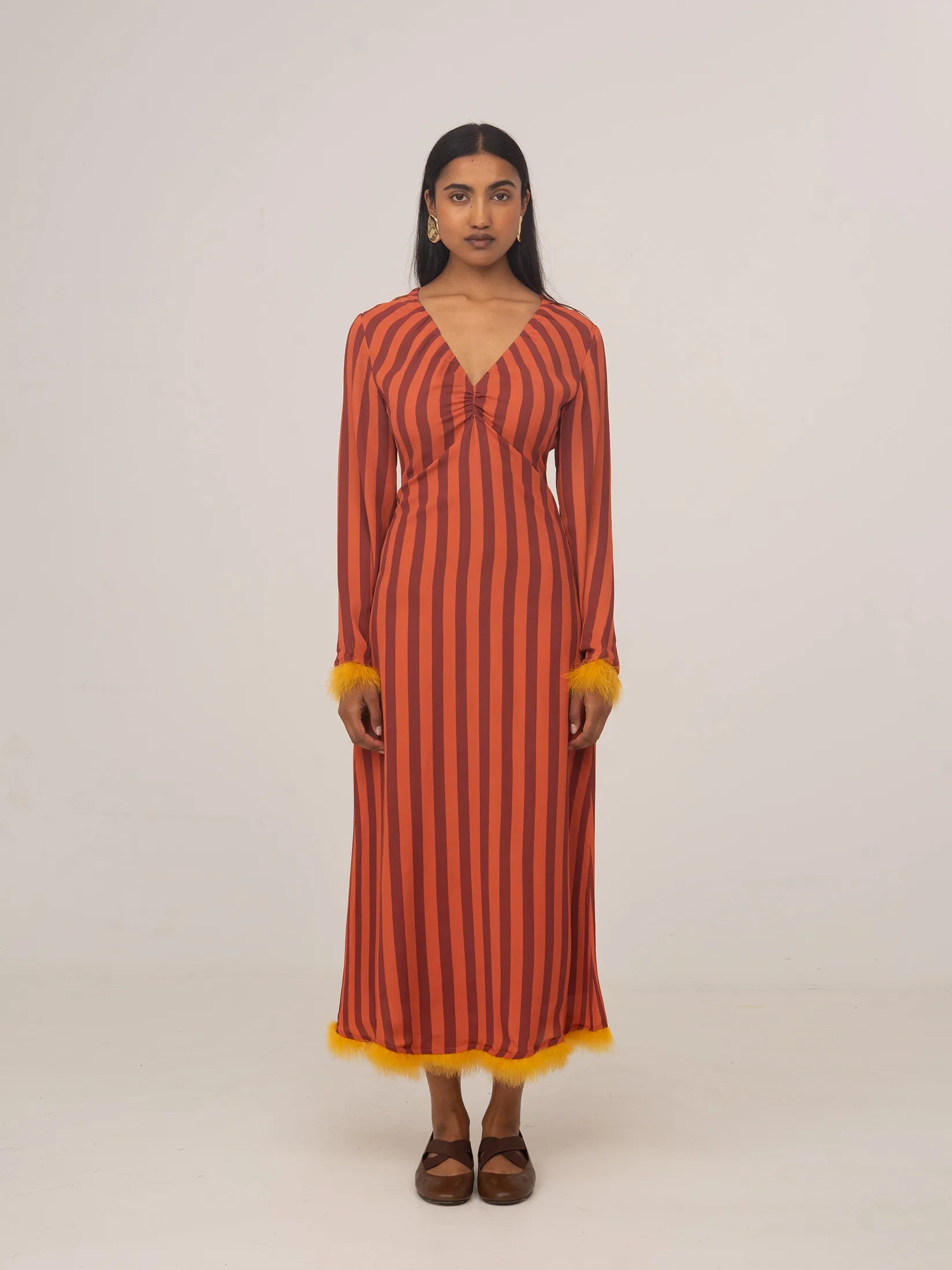 Long occasion dress with red and orange stripes