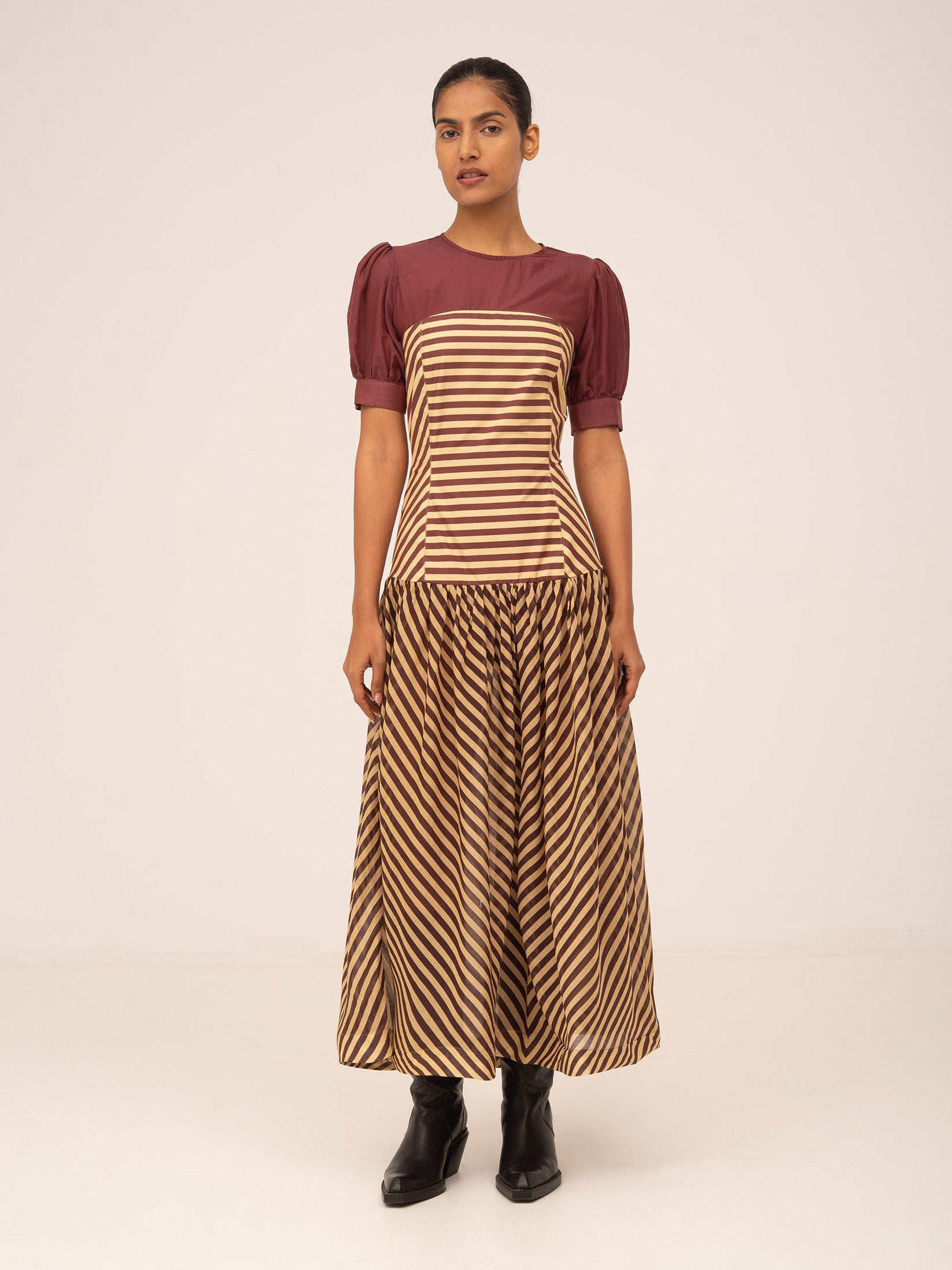 Long burgundy striped dress with a fitted bodice