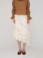 Completa tu look con Mousse White Midi Skirt